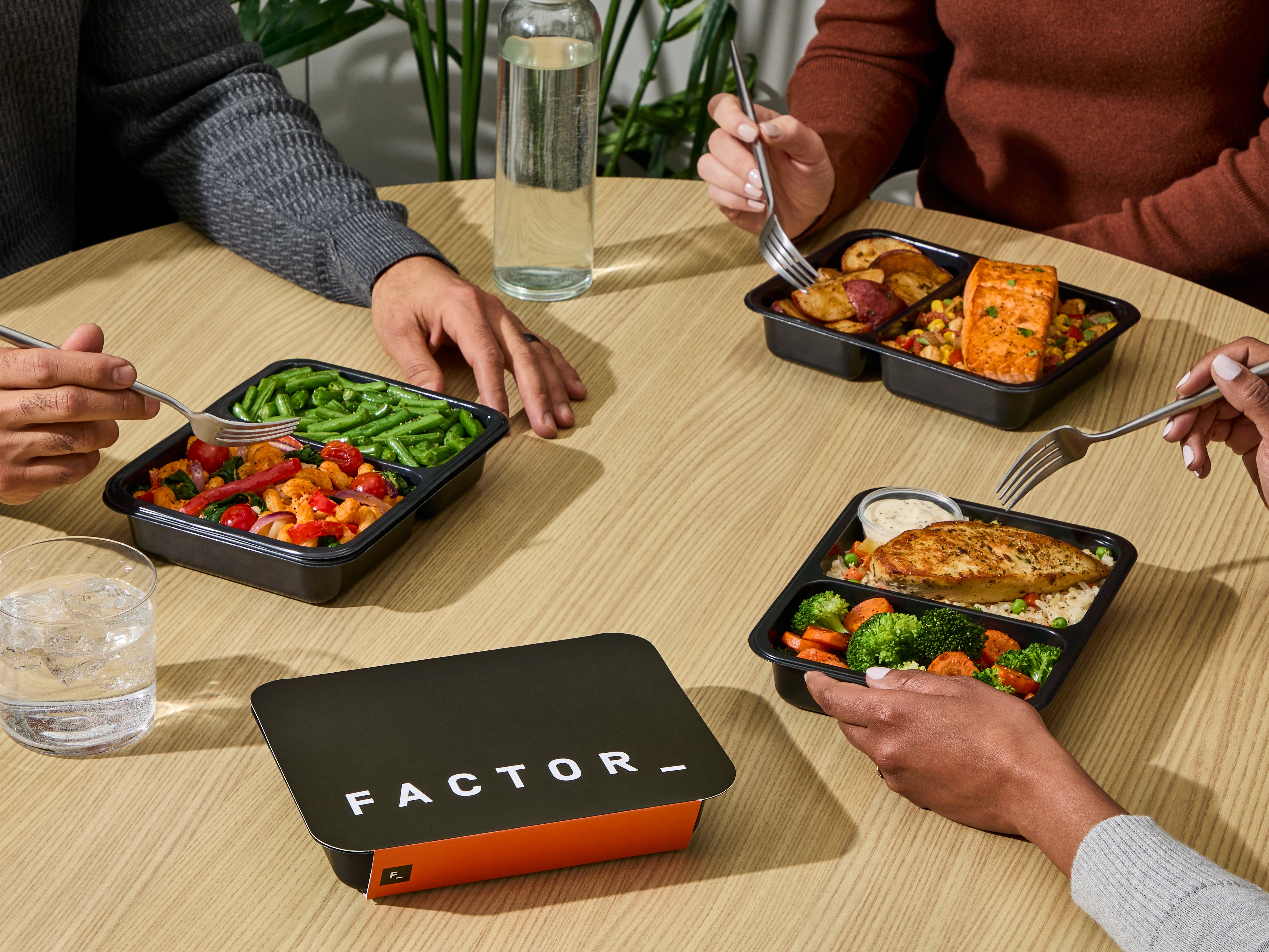 Team eating together in office